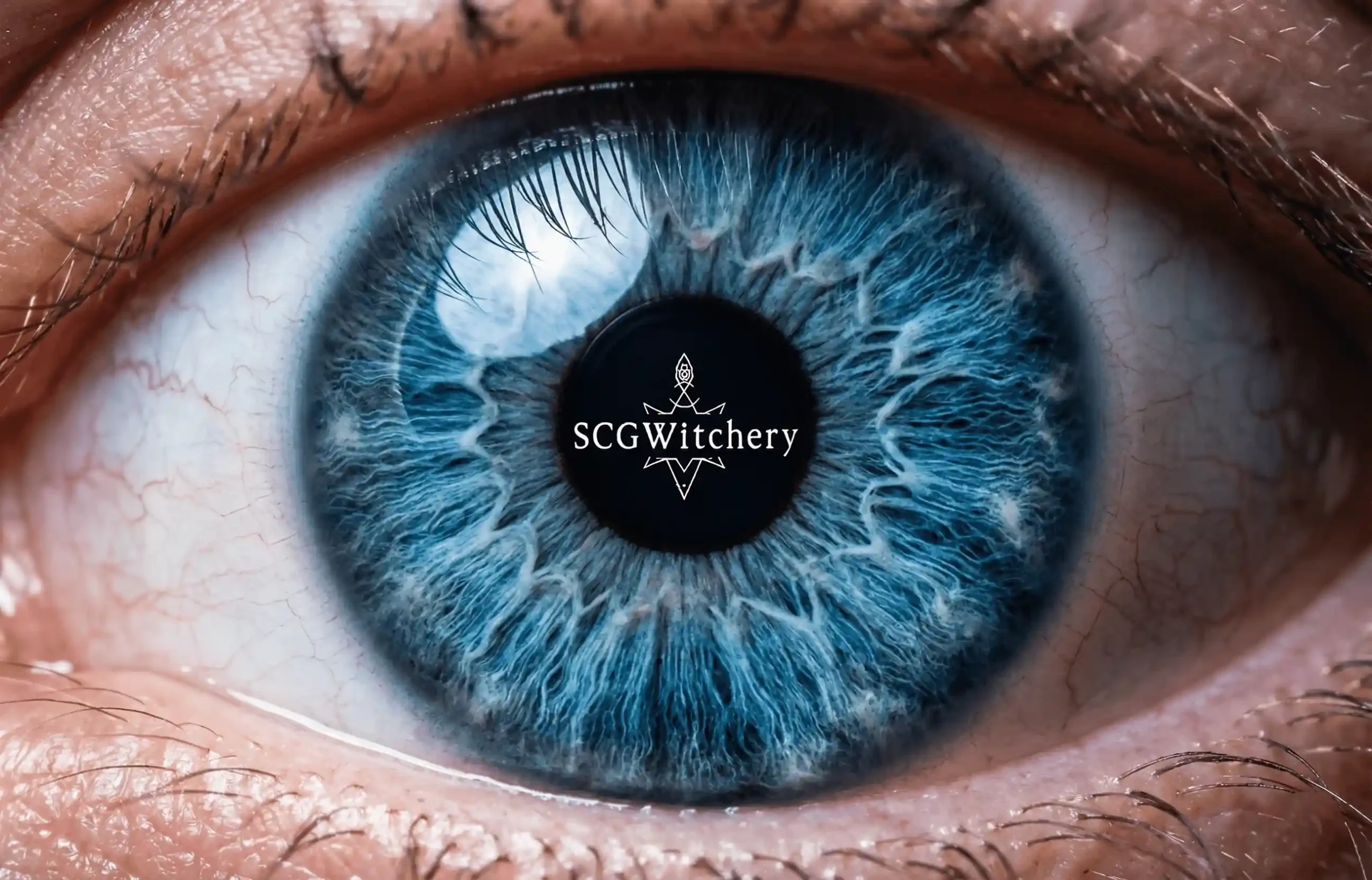 scg witchery logo in a blue eye